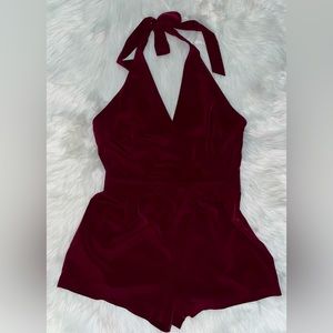 Size L V-Neck romper, ties around the neck zips on the size